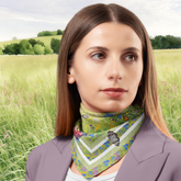 Woman wearing a floral scarf with a green field background