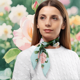 Woman wearing a floral scarf with a garden background