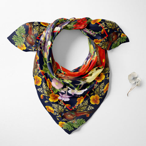 Exquisite Pheasant Silk Scarf. Rich brown tones and vibrant floral bursts create a captivating design. Crafted from 100% silk twill with meticulous hand-stitched detailing. Presented in a Silktopia box, a perfect gift. Shop now and make a refined statement.