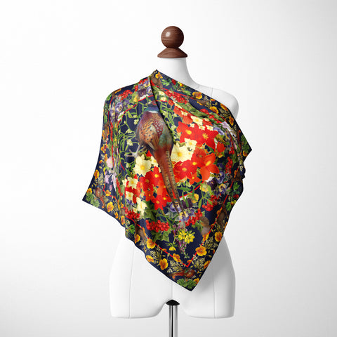Exquisite Pheasant Silk Scarf. Rich brown tones and vibrant floral bursts create a captivating design. Crafted from 100% silk twill with meticulous hand-stitched detailing. Presented in a Silktopia box, a perfect gift. Shop now and make a refined statement.