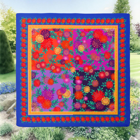 Colorful floral patterned fabric with a blue border against a garden background