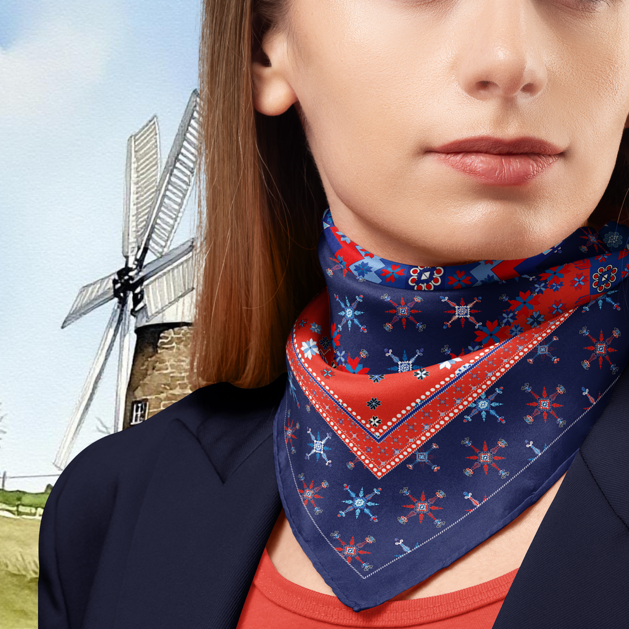 Woman wearing a patterned scarf with a windmill in the background