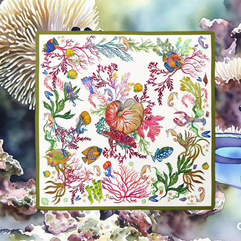 Colorful illustration of marine life and coral on a white background, surrounded by actual coral.