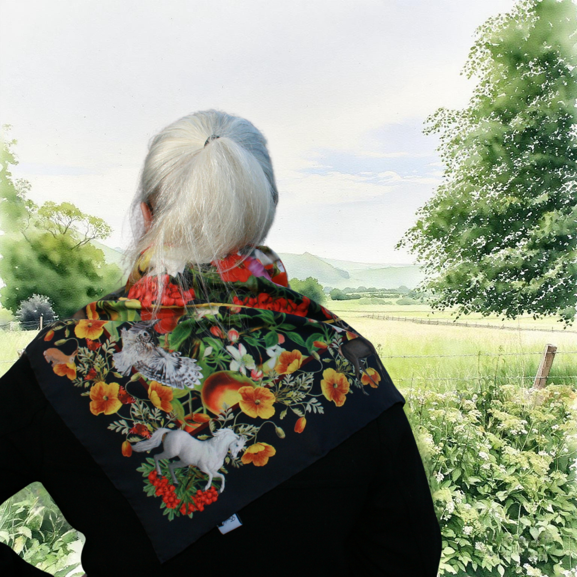 Person wearing a floral embroidered jacket in a natural setting